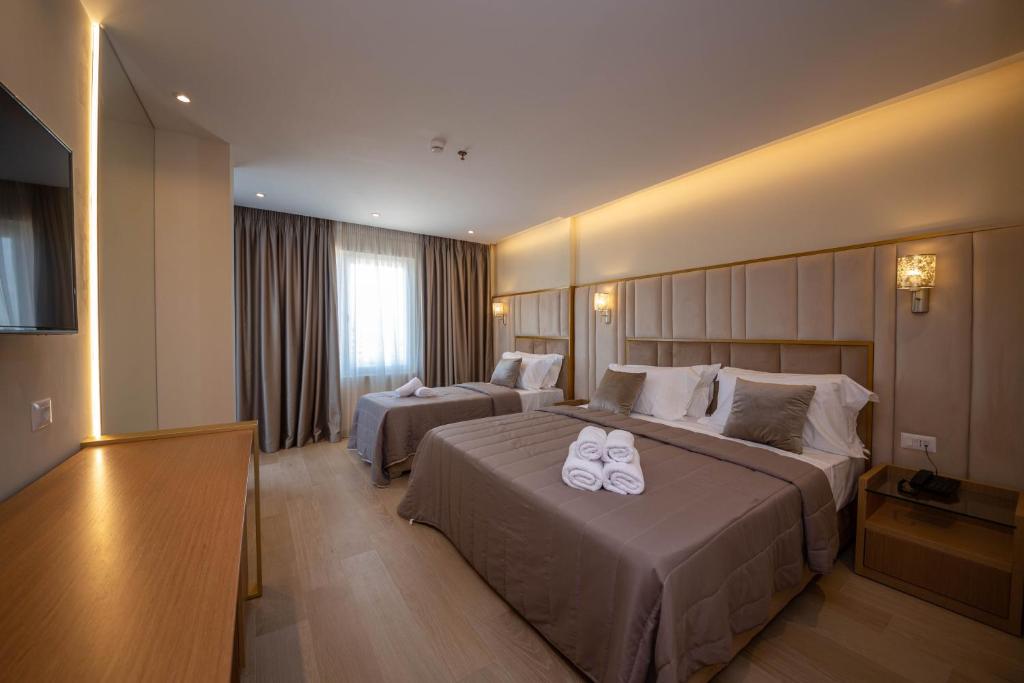 Postel nebo postele na pokoji v ubytování Merar Hotel