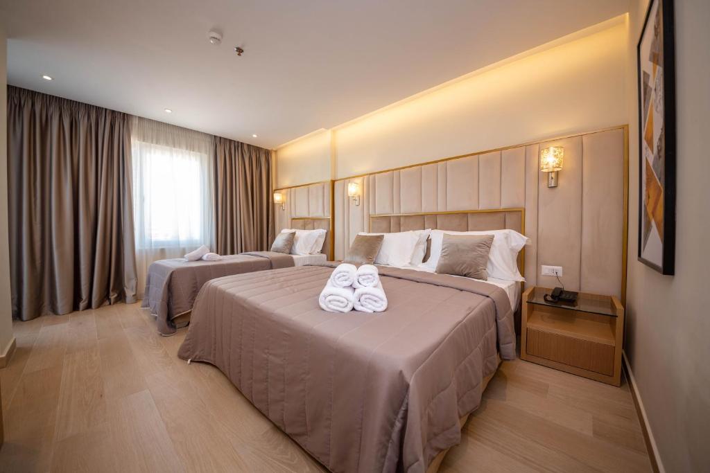 Postel nebo postele na pokoji v ubytování Merar Hotel