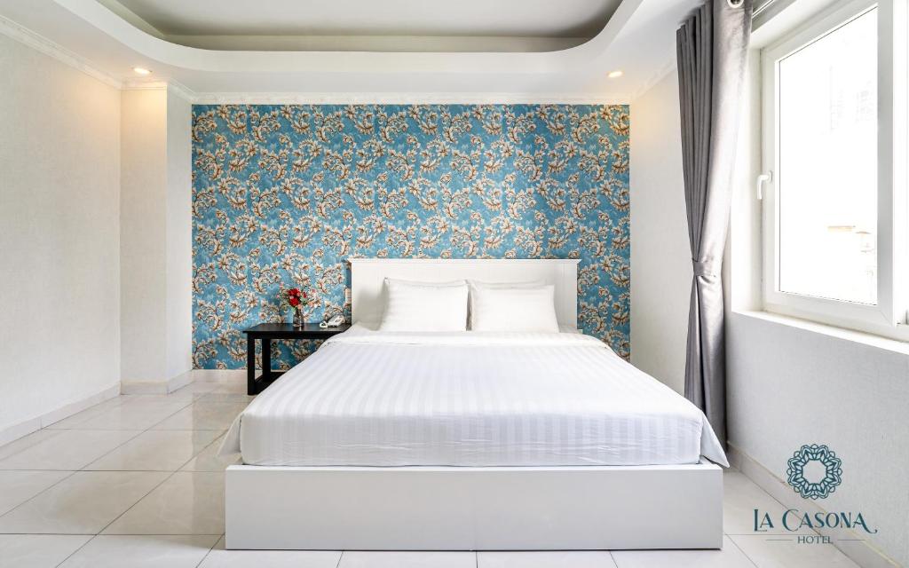 Giường trong phòng chung tại La Casona Hotel