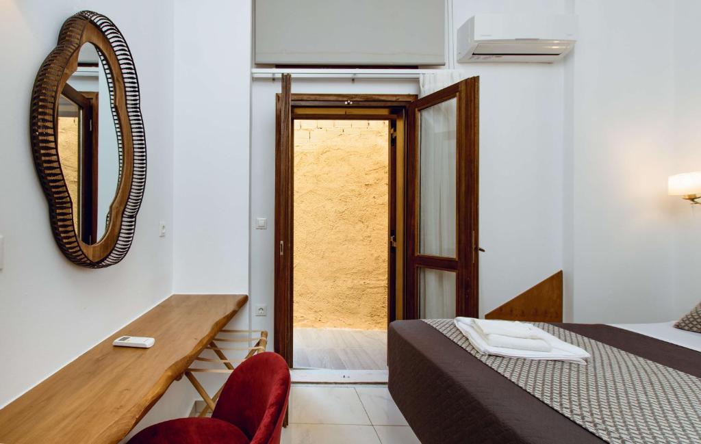 Postel nebo postele na pokoji v ubytování Deluxe Suites