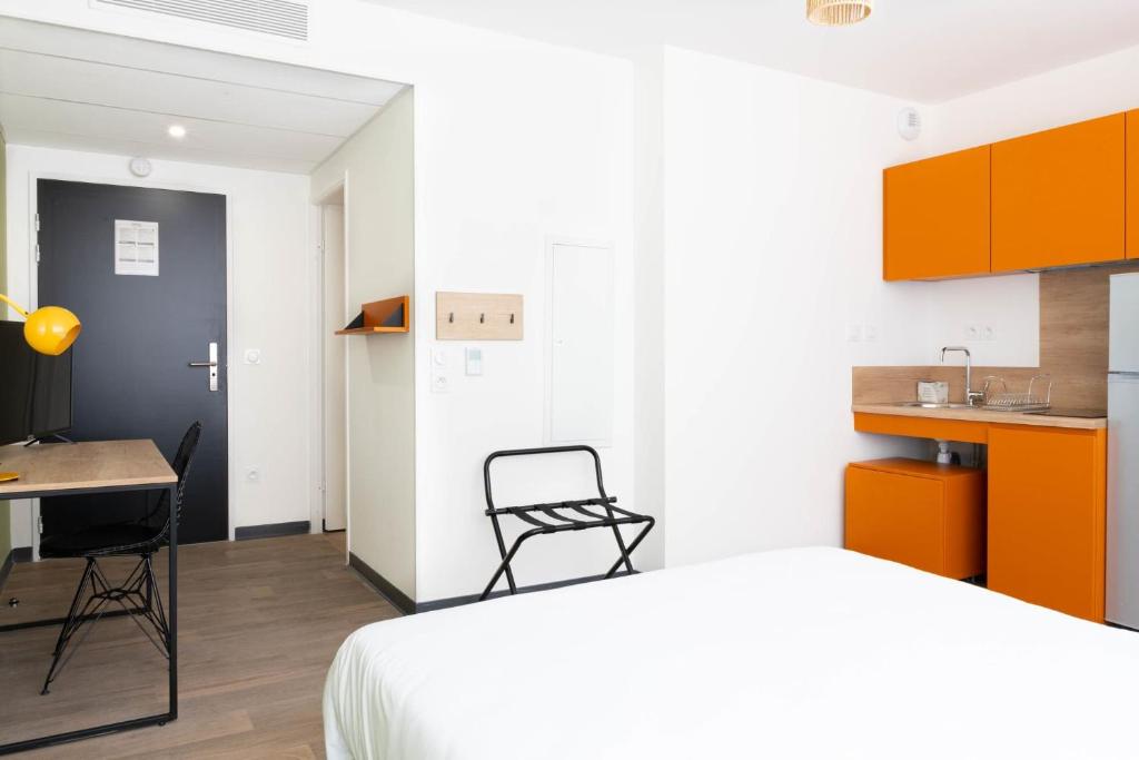 Postel nebo postele na pokoji v ubytování Kabane Montpellier