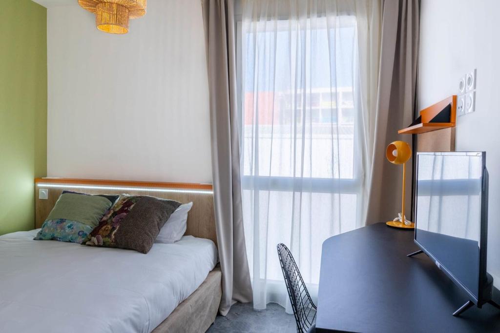 Postel nebo postele na pokoji v ubytování Kabane Montpellier