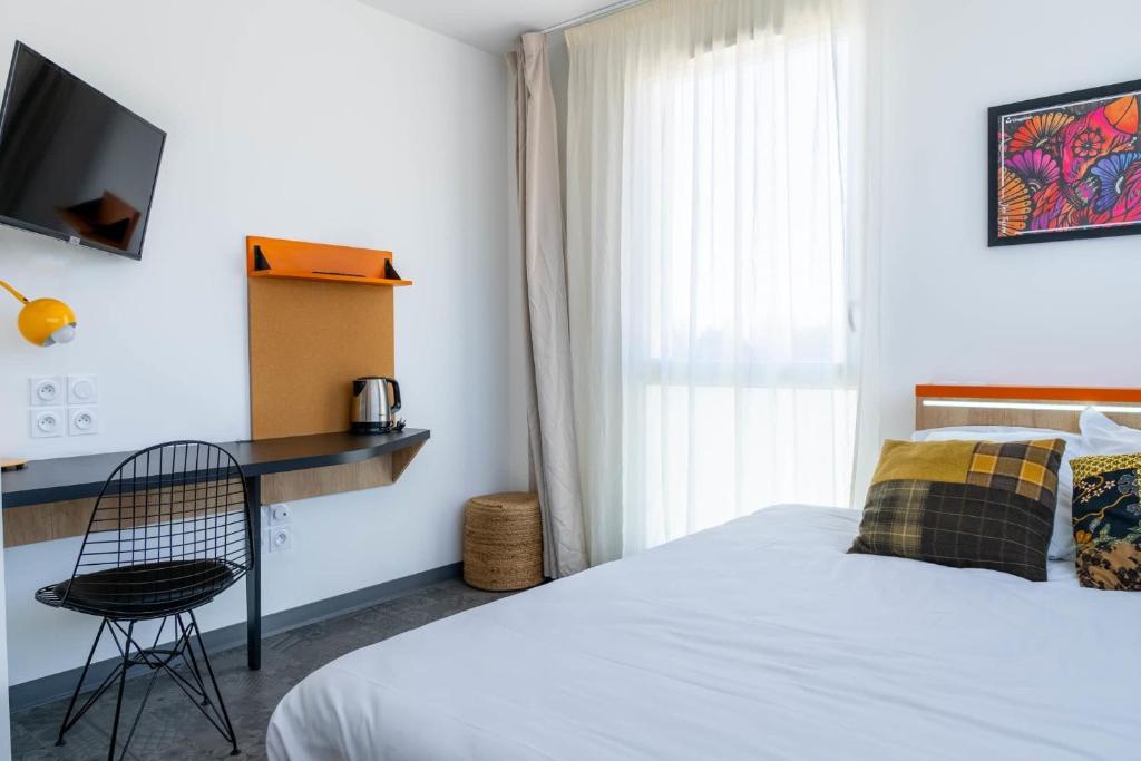 Postel nebo postele na pokoji v ubytování Kabane Montpellier
