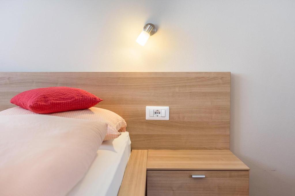 Postel nebo postele na pokoji v ubytování Hilber App Sass Rigais