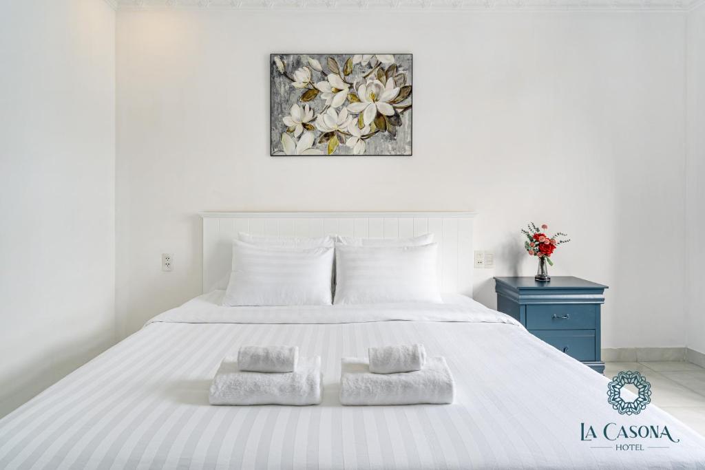 Giường trong phòng chung tại La Casona Hotel