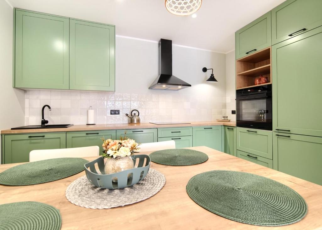Kuchyň nebo kuchyňský kout v ubytování Apartament Oliwkowy