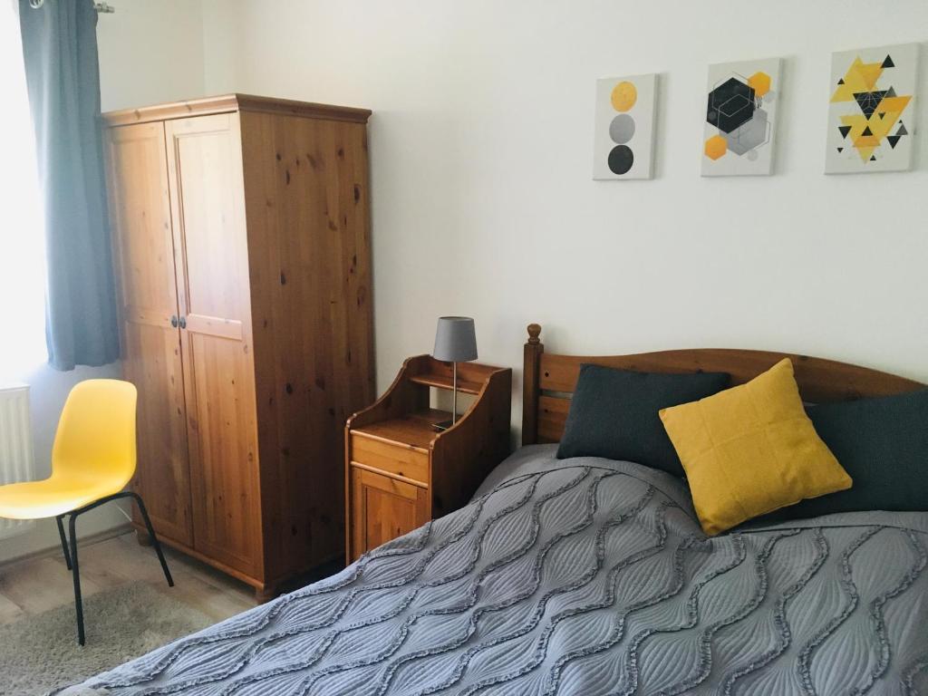 Posteľ alebo postele v izbe v ubytovaní KATÓ APARTMAN