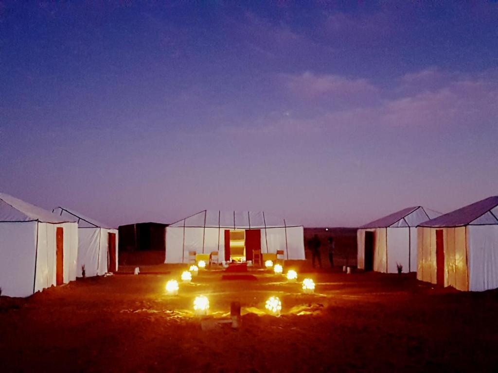a room with a bunch of lights in it at Sahara Desert Experience camp in Merzouga
