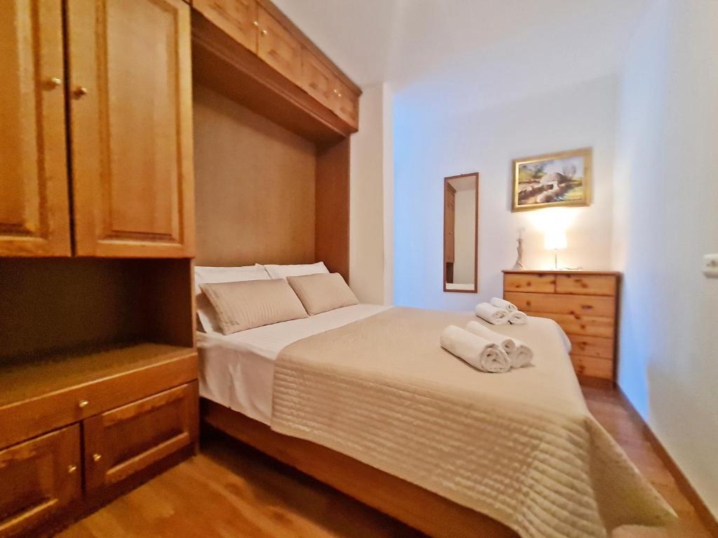 Postel nebo postele na pokoji v ubytování Apartment Nina Marie II