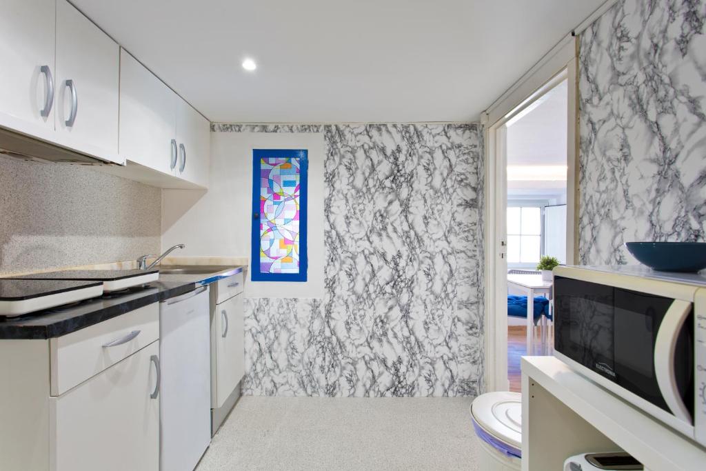 Kuchyň nebo kuchyňský kout v ubytování Oporto Blue Picaria - Unique Citycenter Apartment