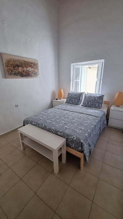 Posteľ alebo postele v izbe v ubytovaní Kozas Art House, Symi
