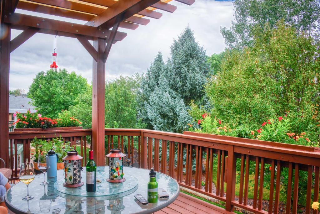 a deck with a table and a pergola at Charming Home with Yard about 12 Mi to Fort Collins in Loveland
