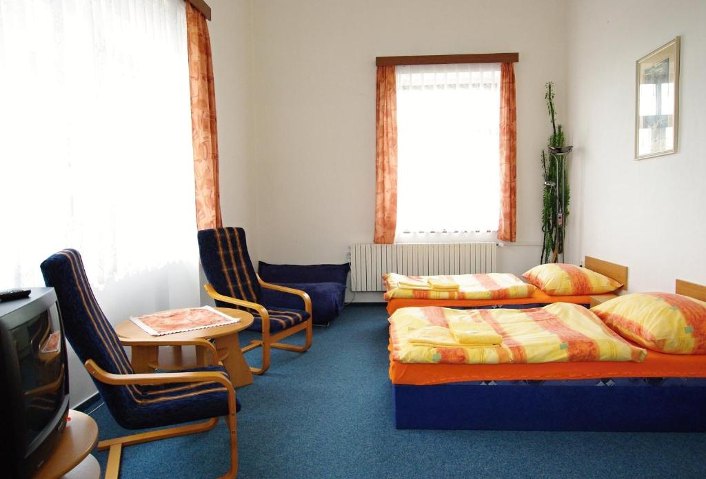 Postel nebo postele na pokoji v ubytování Koleje Zamecek