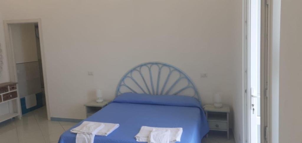 Postel nebo postele na pokoji v ubytování Residenze Azzurra