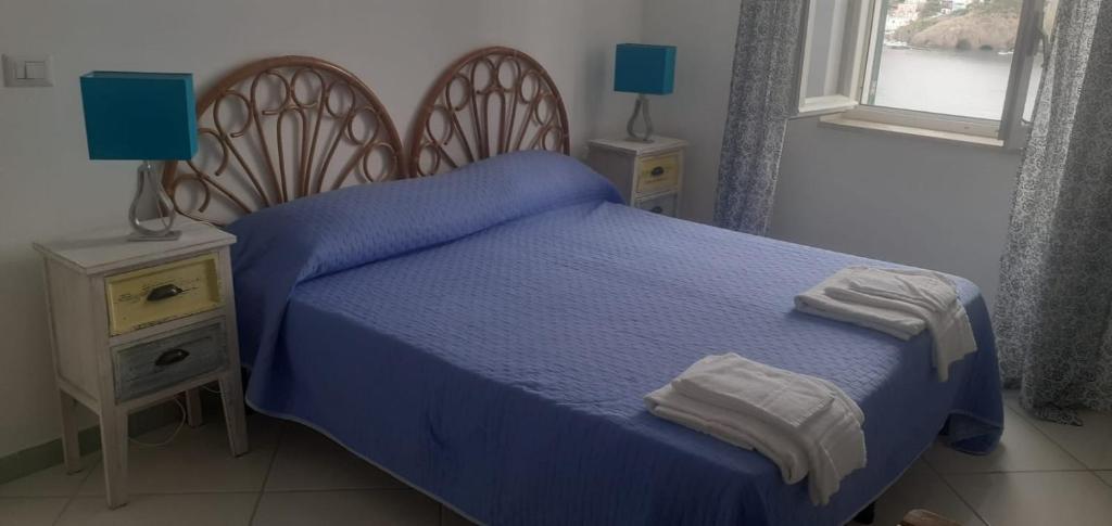 Postel nebo postele na pokoji v ubytování Residenze Azzurra