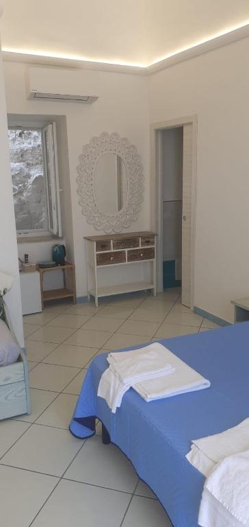 Postel nebo postele na pokoji v ubytování Residenze Azzurra