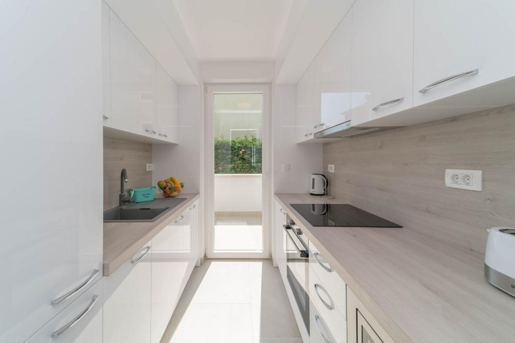 Kuchyňa alebo kuchynka v ubytovaní A&V Residence
