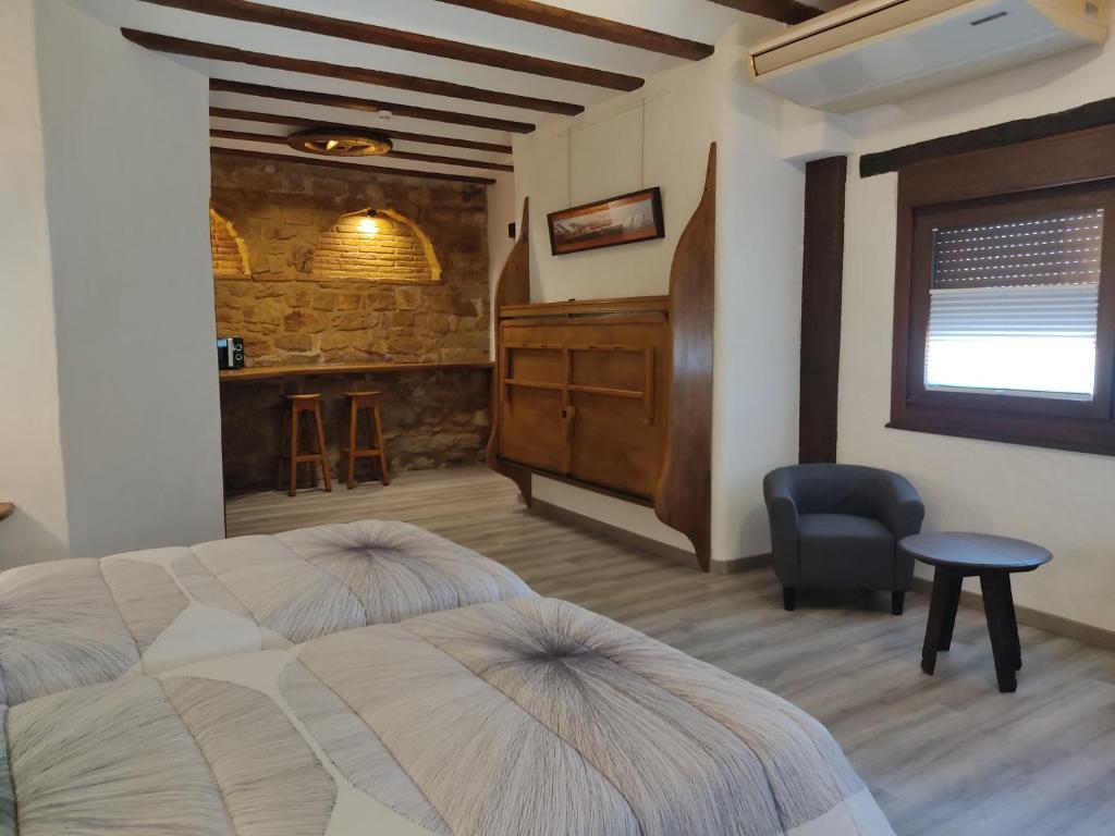 Postel nebo postele na pokoji v ubytování Hostal Suetxe