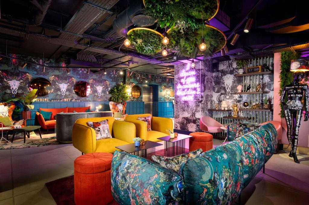 a living room filled with lots of furniture at YOTEL Manchester Deansgate in Manchester