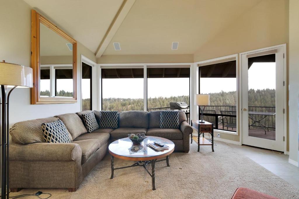 a living room with a couch and a table at River Ridge 420AB in Bend