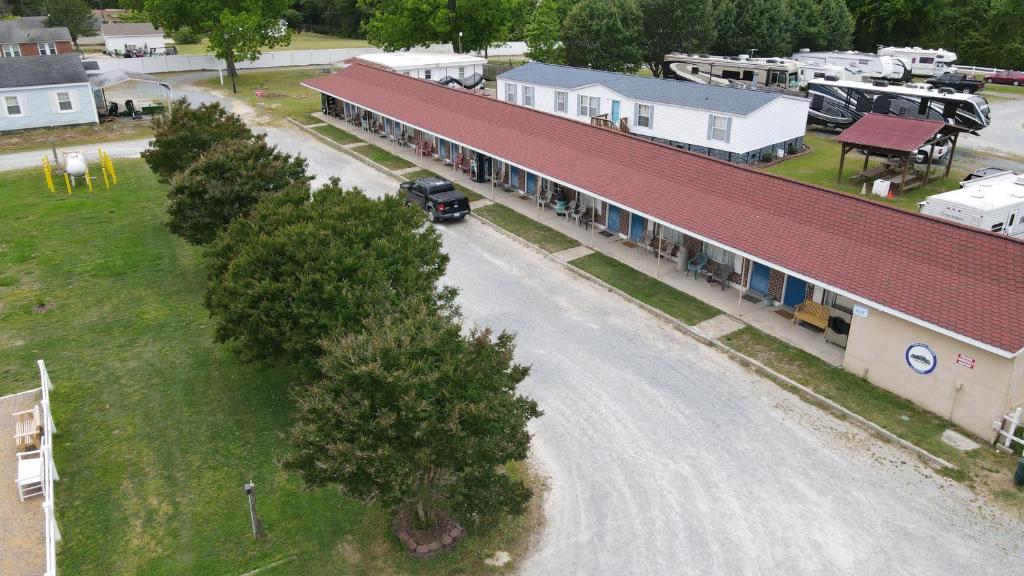 an aerial view of a building in a small town at Four Oaks Lodging in Smithfield
