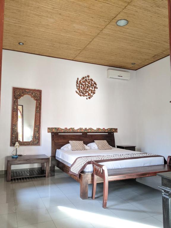 Postel nebo postele na pokoji v ubytování Ubud Dream