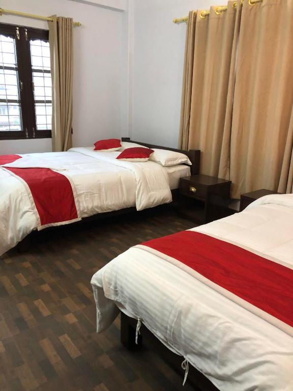 Llit o llits en una habitació de Hotel Bhagya