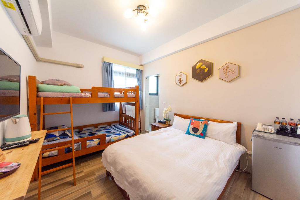 Postel nebo postele na pokoji v ubytování Jinguann B&B