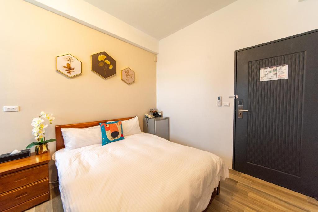 Postel nebo postele na pokoji v ubytování Jinguann B&B