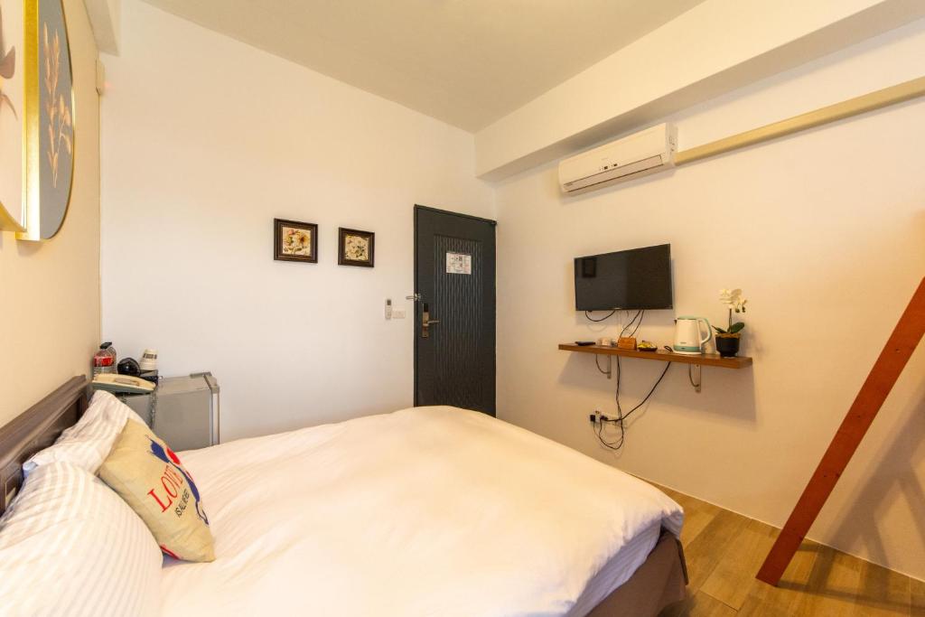 TV a/nebo společenská místnost v ubytování Jinguann B&B