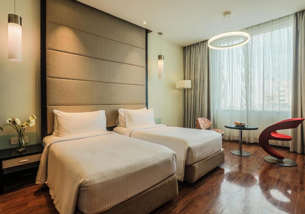 Postel nebo postele na pokoji v ubytování E Hotel