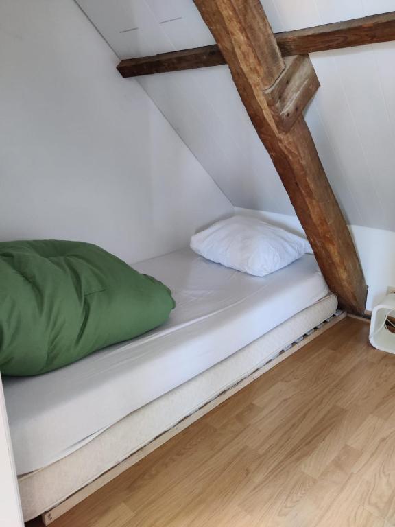 Postel nebo postele na pokoji v ubytování De Lucarne