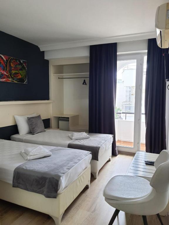 Postel nebo postele na pokoji v ubytování Z OTEL