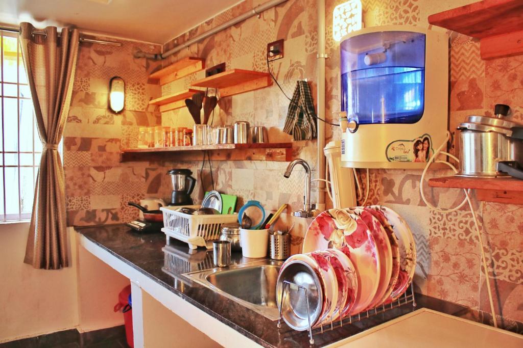 Kuchyň nebo kuchyňský kout v ubytování Pink Villa Mamallapuram