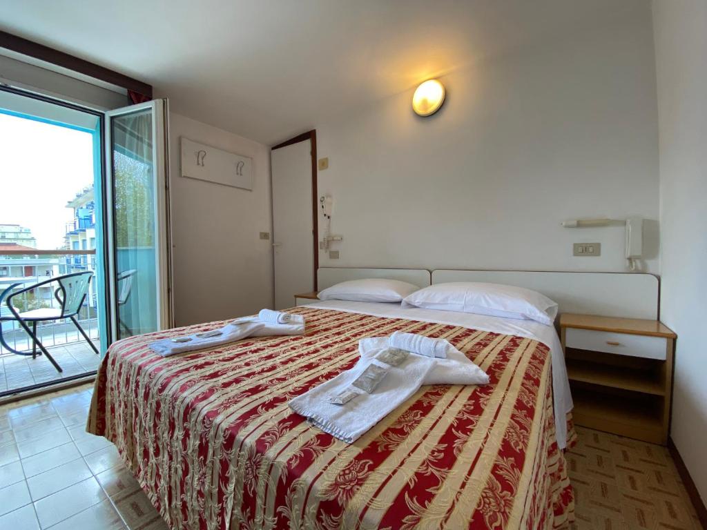 Posteľ alebo postele v izbe v ubytovaní Hotel Nanni Garnì