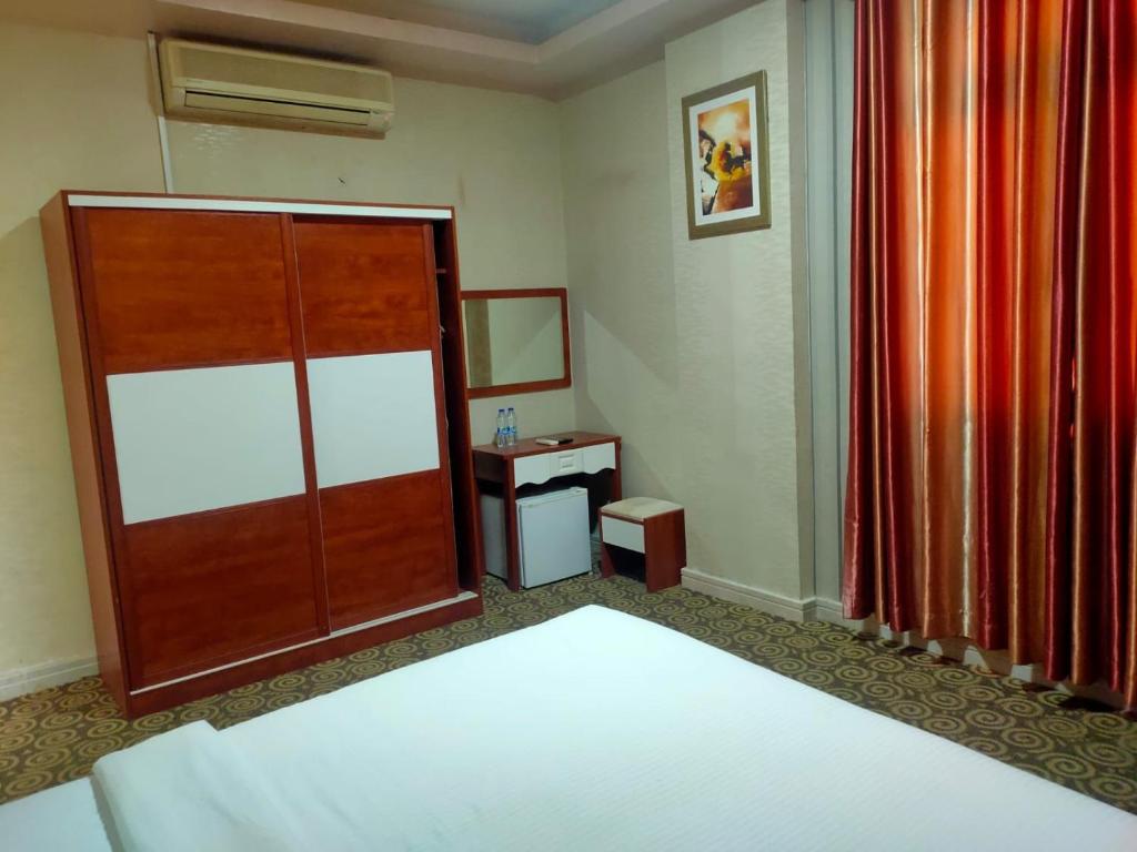 Postel nebo postele na pokoji v ubytování Grand Inn Hotel By Wanasa