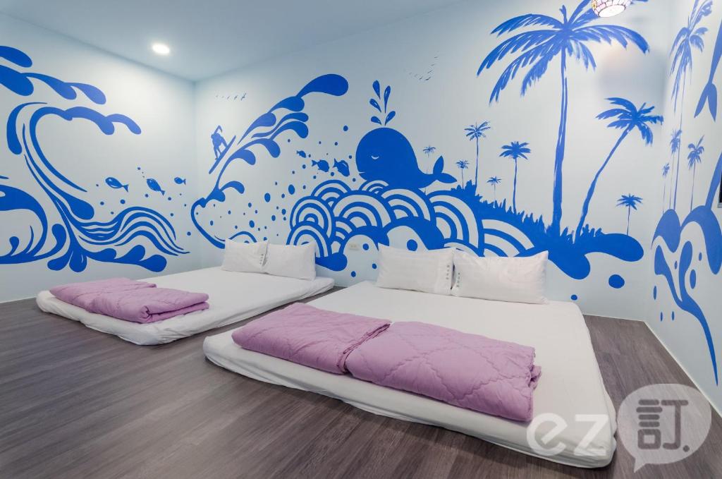 Postel nebo postele na pokoji v ubytování Mu Yu B&B