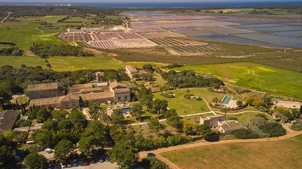 an aerial view of a building with trees and a field at Fontsanta Hotel Thermal & Spa - Adults Only in Colònia de Sant Jordi