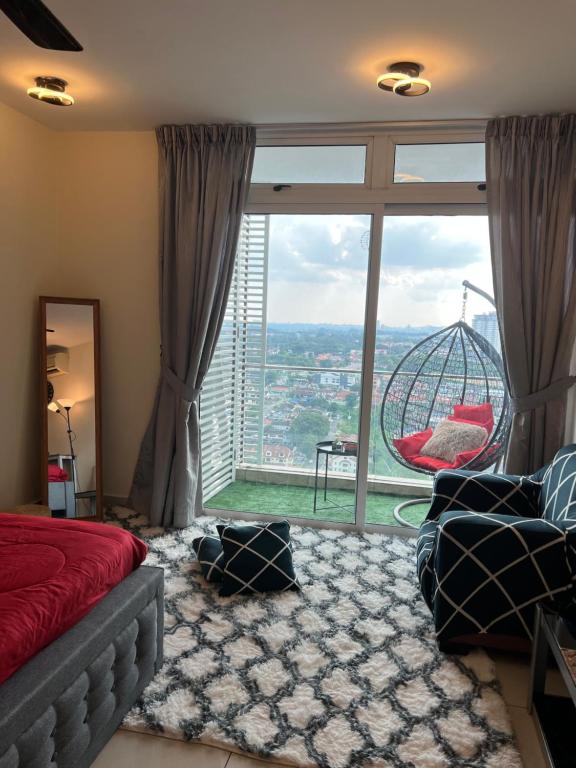 a bedroom with a large window with a roller coaster at Ksl D'Esplanade Studio Apartment's 3 in Johor Bahru