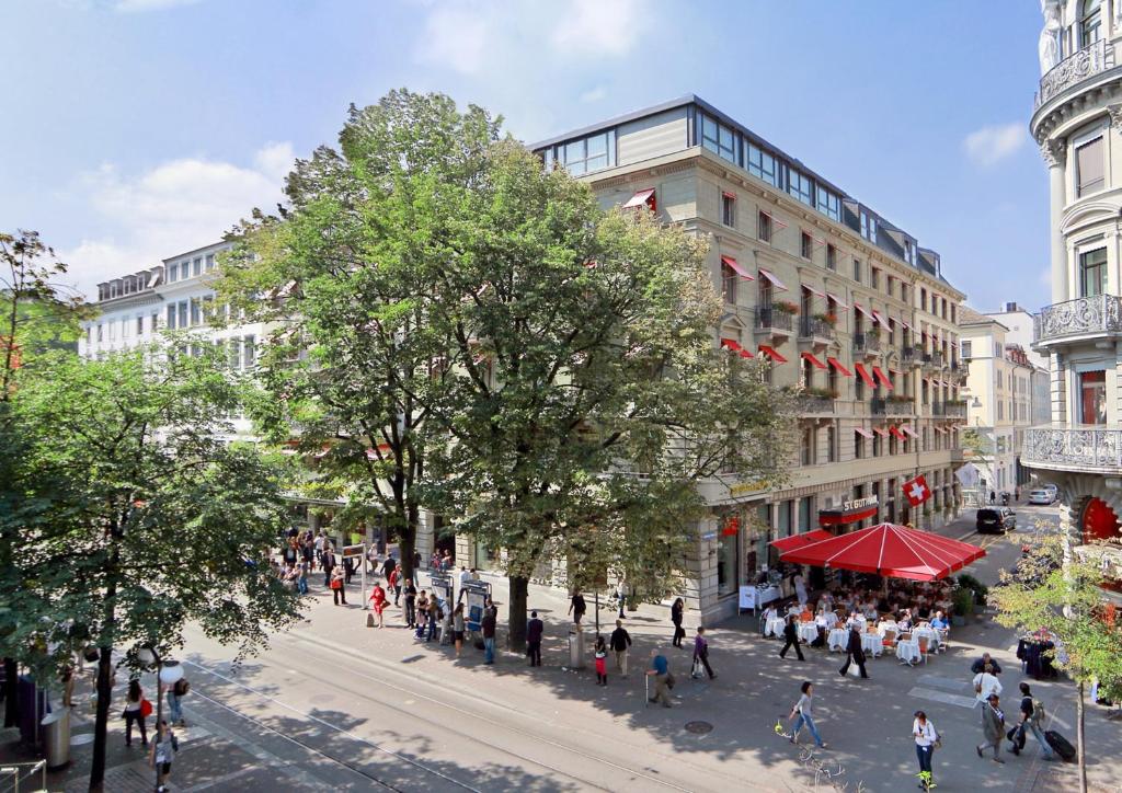a rendering of a city street with people walking at Hotel St.Gotthard in Zurich