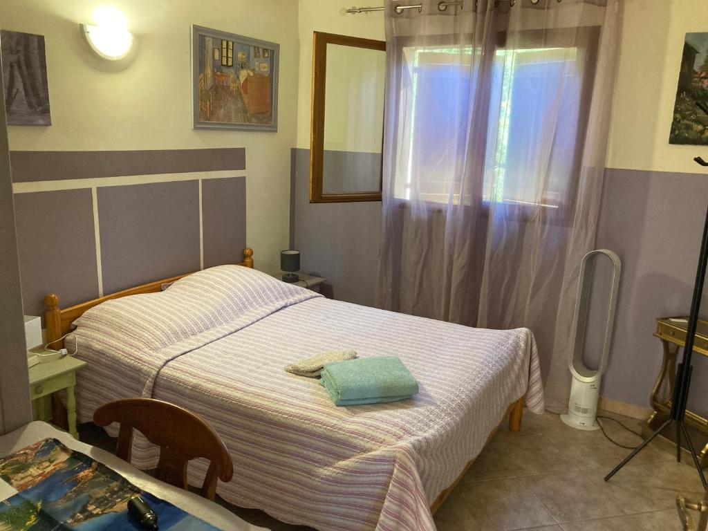 a small bedroom with two beds and a window at B&amp;B Macchia Verdata avec piscine in Monacia-dʼAullène