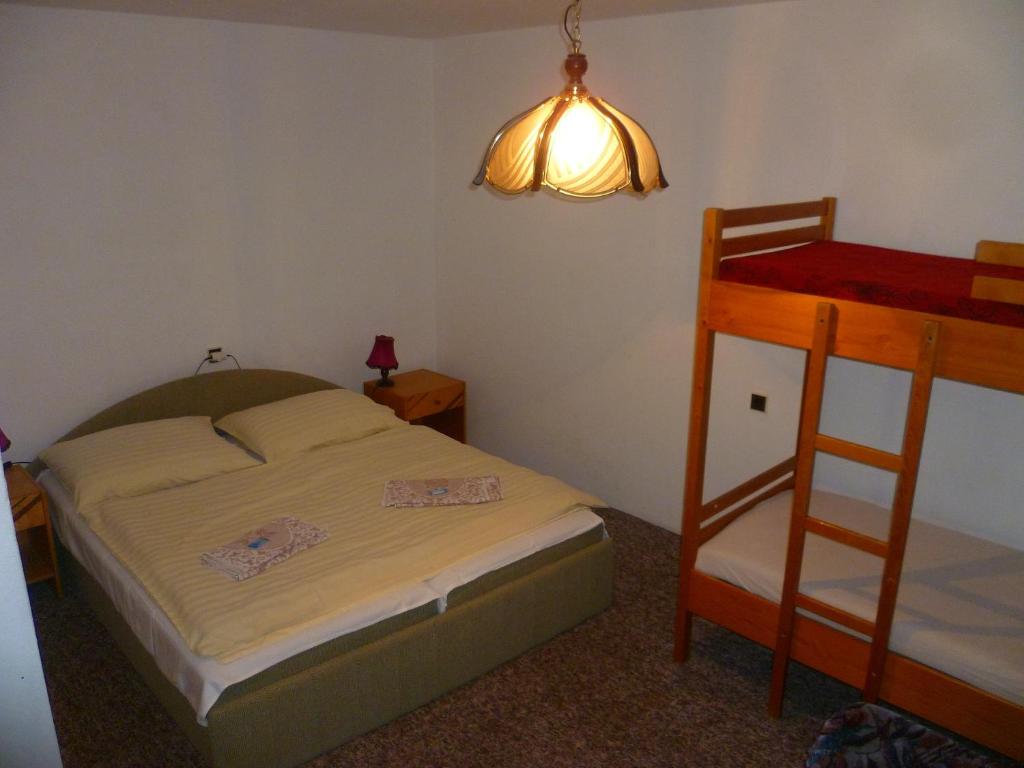 Postel nebo postele na pokoji v ubytování Pension Migr