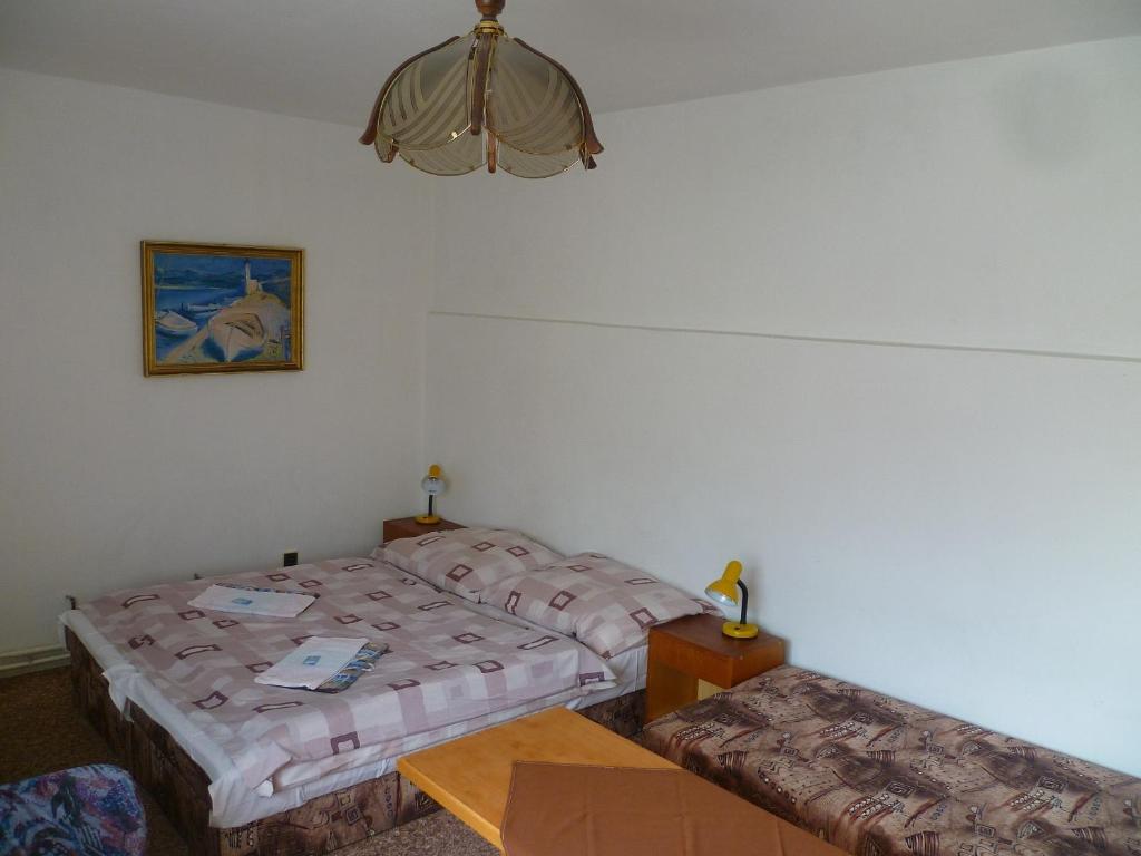 Postel nebo postele na pokoji v ubytování Pension Migr