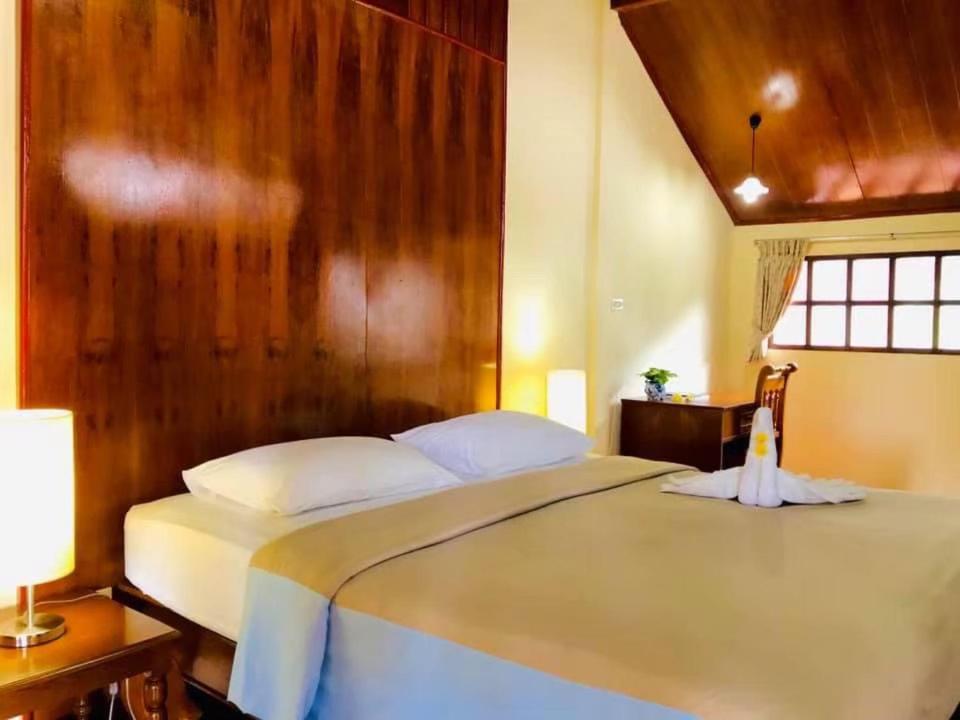 Postel nebo postele na pokoji v ubytování Utopia Resort