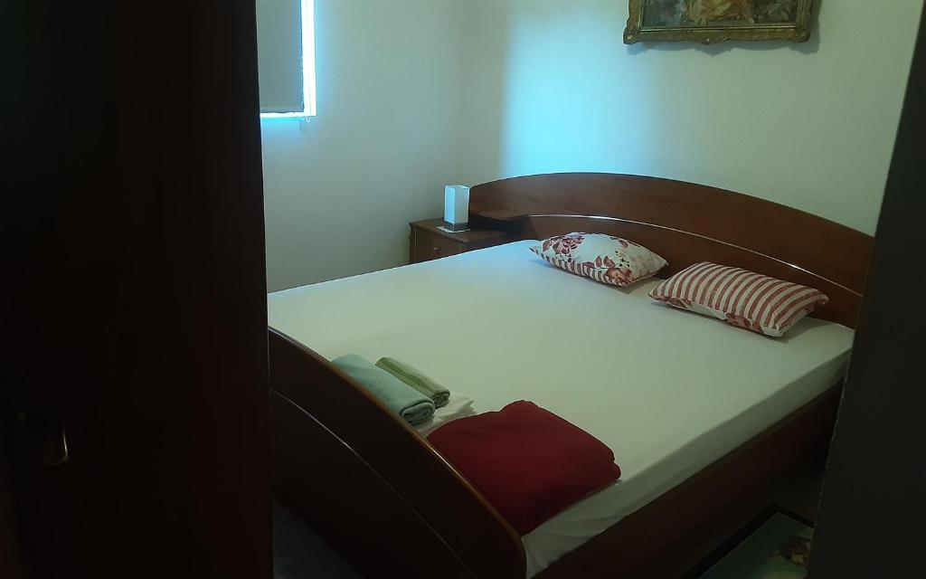 Posteľ alebo postele v izbe v ubytovaní Apartments Nena 3*