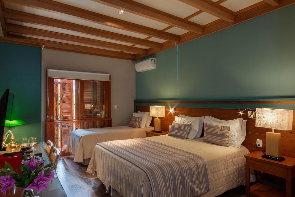 Postel nebo postele na pokoji v ubytování Hotel Boutique Britanico