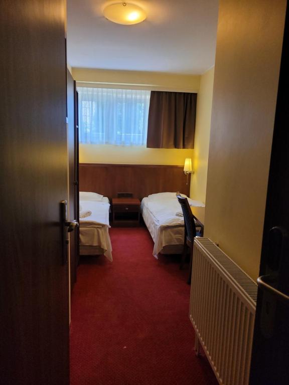 Postel nebo postele na pokoji v ubytování Virgo B&B Biznes Rumia