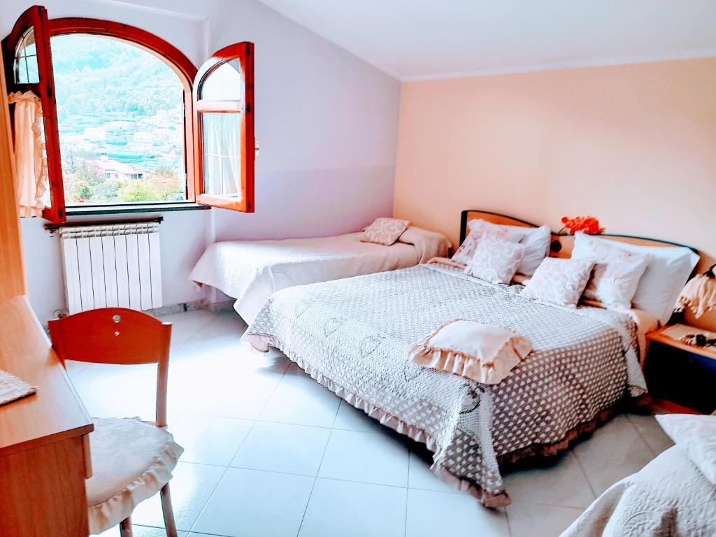 Postel nebo postele na pokoji v ubytování Hotel affittacamere novella