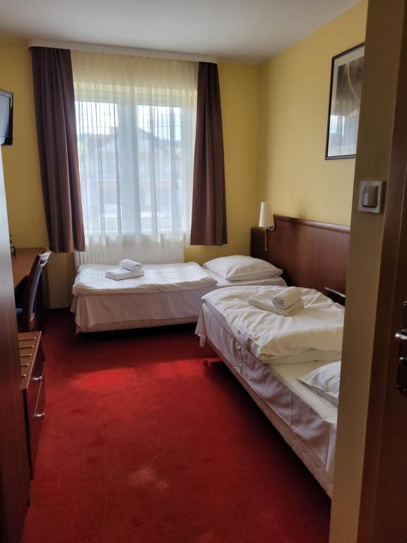 Postel nebo postele na pokoji v ubytování Virgo B&B Biznes Rumia
