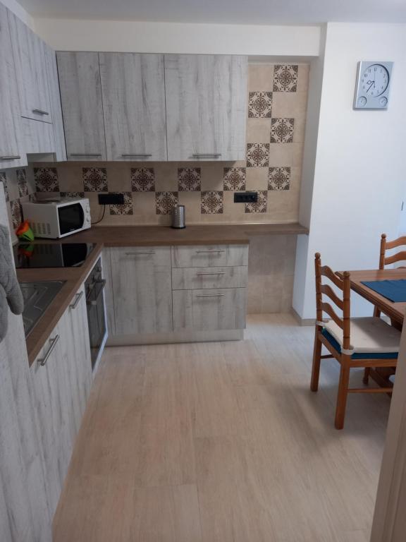 Kuchyň nebo kuchyňský kout v ubytování Casa con vista a Moena